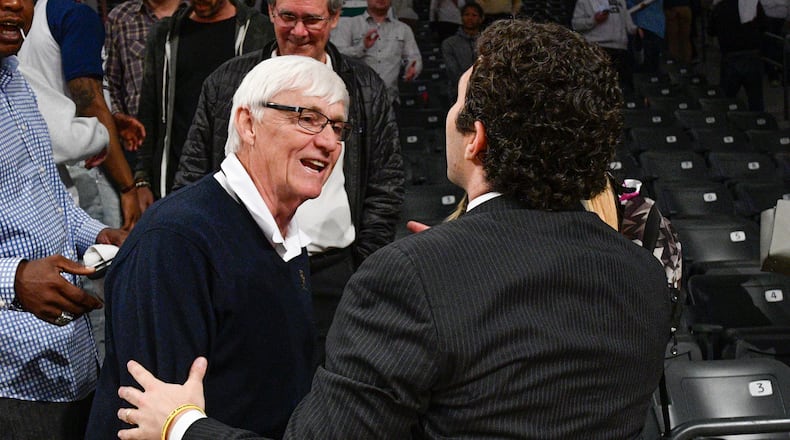 Past Georgia Tech head coach Bobby Cremins, left, and present head coach Josh Pastner celebrate after an NCAA college basketball game against Syracuse , Sunday, Feb. 19, 2017, in Atlanta. Tech won 71-65. (John Amis)