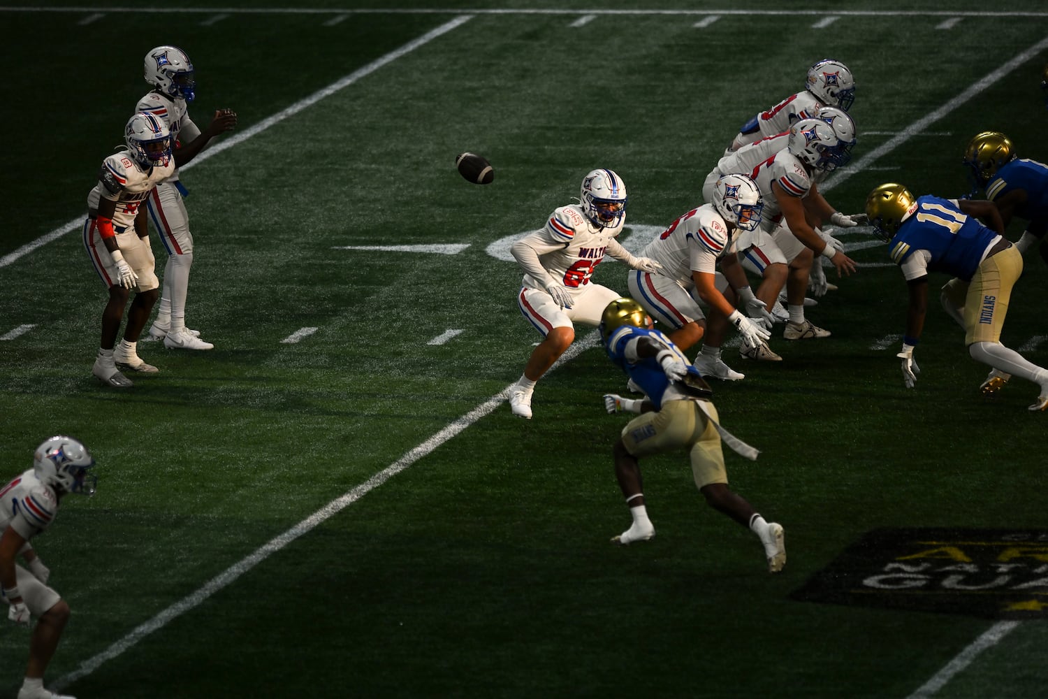 The McEachern Indians face off against the Walton Raiders during the Corky Kell Classic football game Saturday, August 16, 2025 at the Mercedes-Benz Stadium. (Daniel Varnado/For the Atlanta Journal-Constitution)