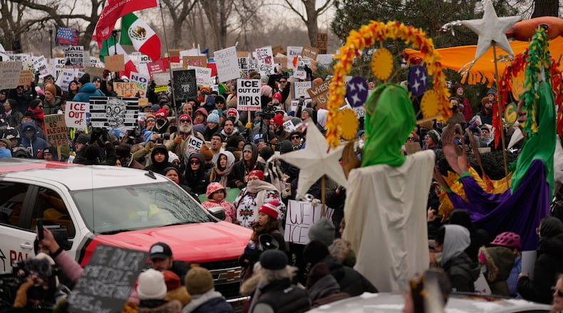 Protesters gather during a rally for Renee Good, who was fatally shot by an ICE officer earlier in the week, Saturday, Jan. 10, 2026, in Minneapolis. (AP Photo/John Locher)