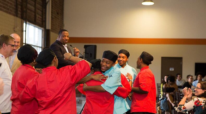 Terry Tucker ( at the microphone) named CEO of Families First. Tucker led the City of Refuge previously. HANDOUT