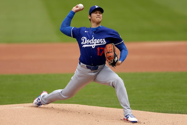 Los Angeles Dodgers' Shohei Ohtani (17), of Japan, throws live batting practice before a baseball game against the New York Mets on Sunday, May 25, 2025, in New York. (AP Photo/Adam Hunger)