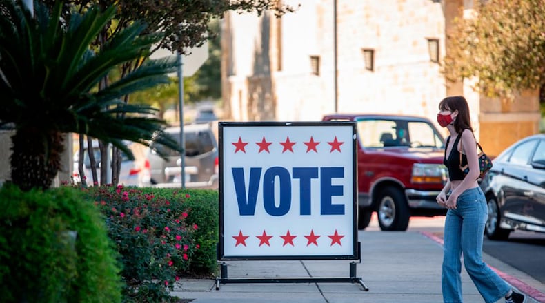 A voter walks toward a polling location on Election Day in Austin, Texas on Nov. 3, 2020. (Sergio Flores/AFP via Getty Images/TNS)