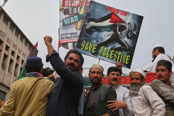 Traders hold a demonstration against Israeli airstrikes and to show solidarity with Palestinian people living in Gaza, in Peshawar, Pakistan Friday, April 18, 2025. (AP Photo/Muhammad Sajjad)