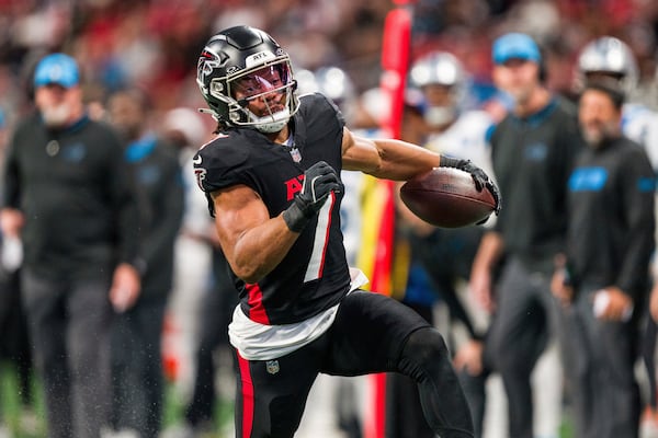FILE - Atlanta Falcons running back Bijan Robinson (7) runs the ball during the first half of an NFL football game against the Carolina Panthers, Sunday, Jan. 5, 2025, in Atlanta. The Panthers defeated the Falcons 44-38. (AP Photo/Danny Karnik, File(
