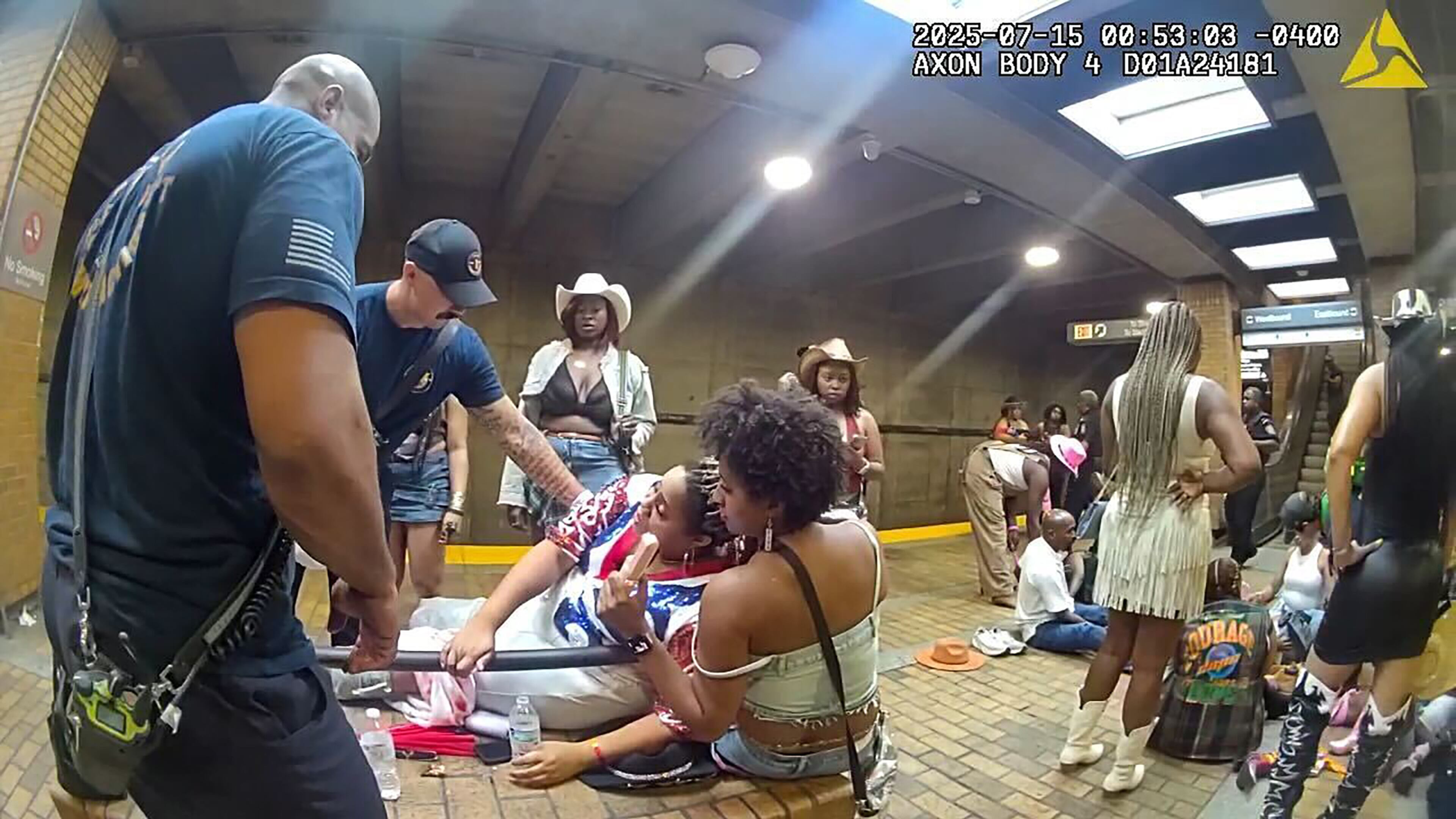 Body cam footage shows people being treated after a MARTA escalator mishap at Vine City Station after a Beyonce concert in Atlanta. (Courtesy of body cam footage