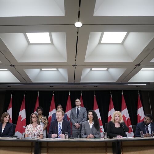 Canadian Identity and Culture Minister Marc Miller speaks as colleagues and medical professionals look on during a news conference in Ottawa, Ontario, Wednesday, June 10, 2026. (Adrian Wyld/The Canadian Press via AP)