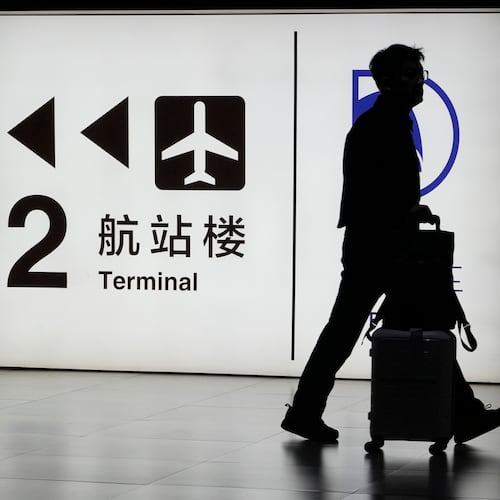 FILE - A passenger arrives at the Capital Airport in Beijing on Nov. 7, 2025. (AP Photo/Ng Han Guan, file)