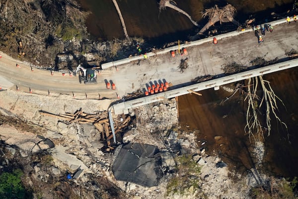 This aerial photo shows damage from flash floods along the Guadalupe River in Ingram, Texas, Thursday, July 10, 2025. (AP Photo/Gerald Herbert)