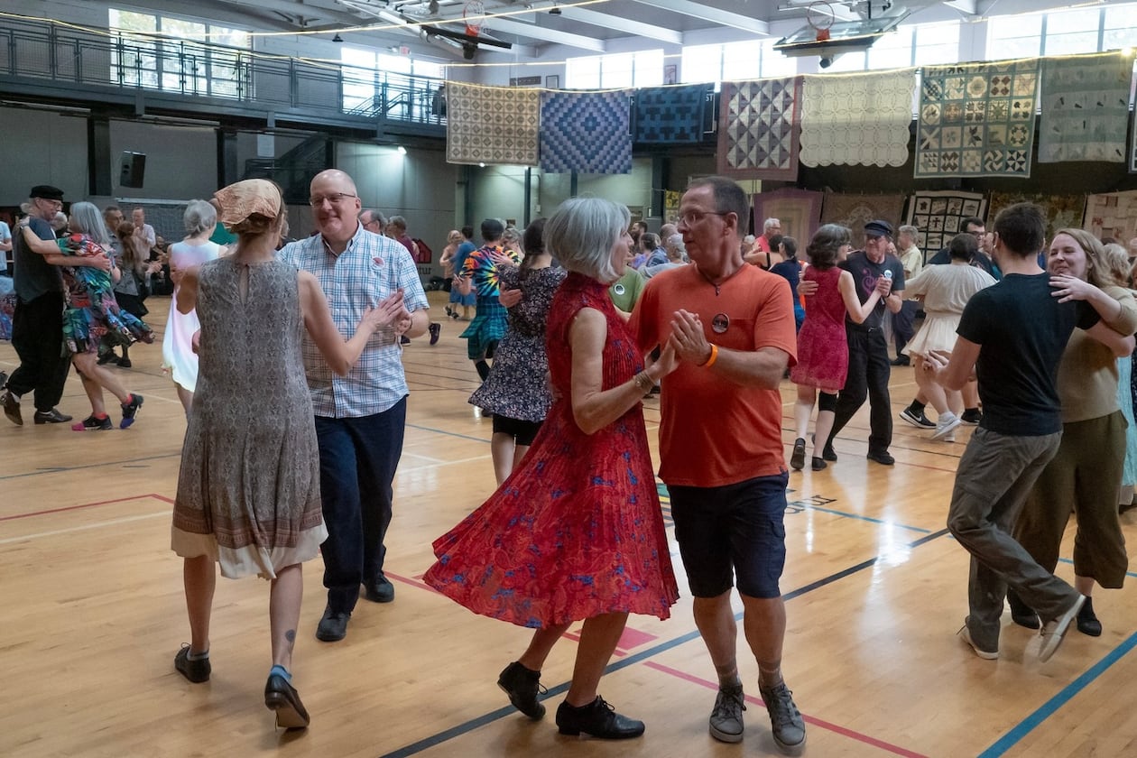 Dancers swing their partners at a contra dance in 2023. (Courtesy of Dave Pokorney)