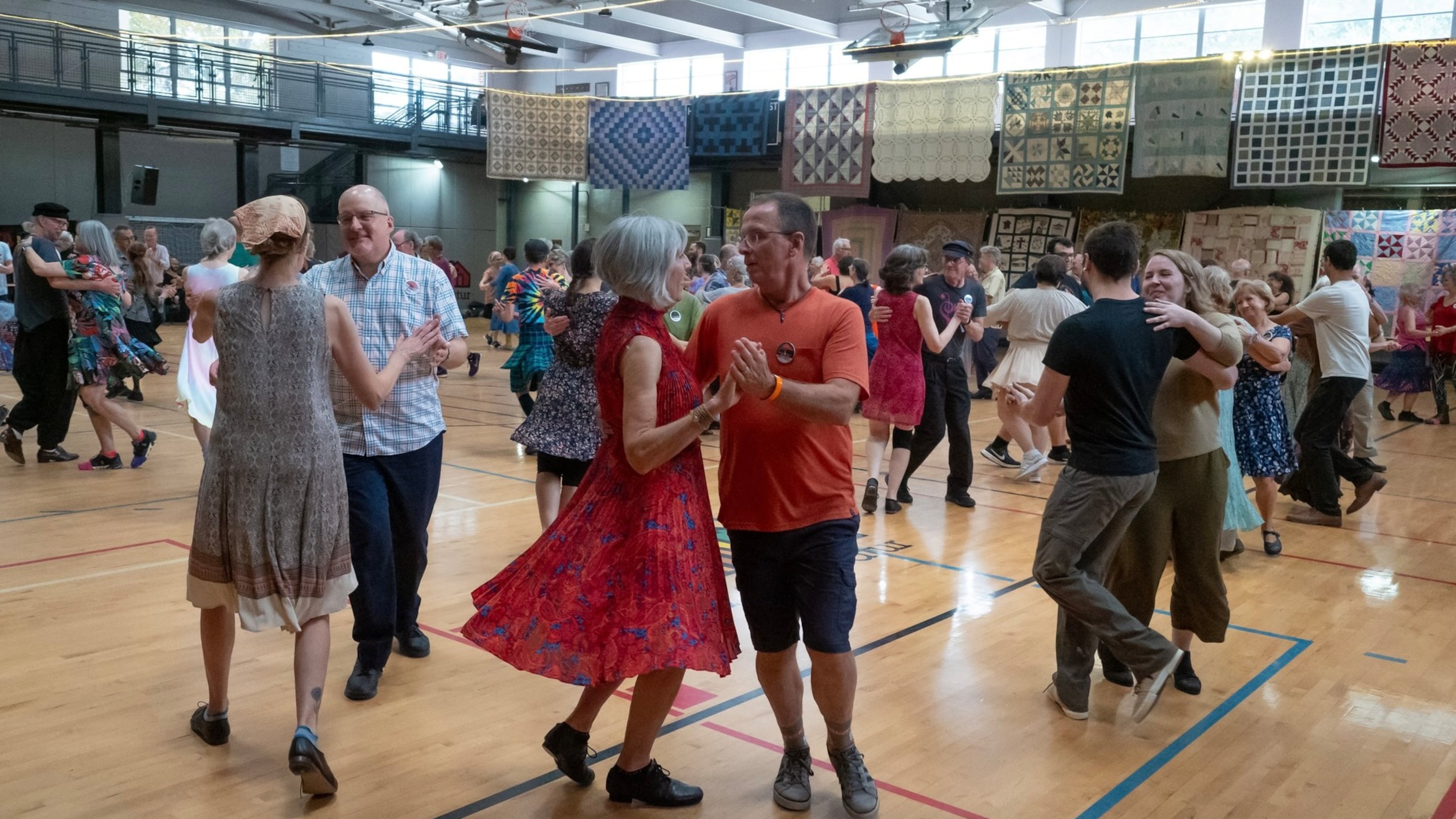 Dancers swing their partners at a contra dance in 2023. (Courtesy of Dave Pokorney)