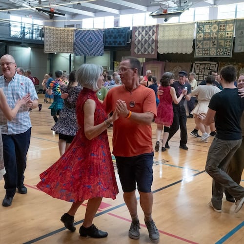 Dancers swing their partners at a contra dance in 2023. (Courtesy of Dave Pokorney)