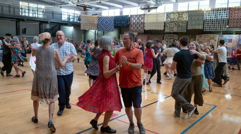 Dancers swing their partners at a contra dance in 2023. (Courtesy of Dave Pokorney)