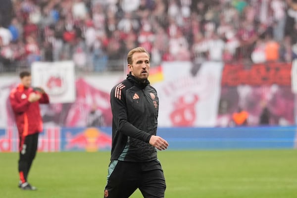 Bayern's Harry Kane walks on the pitch at the end of the German Bundesliga soccer match between RB Leipzig and FC Bayern Munich at the Red Bull Arena in Leipzig, Germany, Saturday, May 3, 2025. (AP Photo/Matthias Schrader)