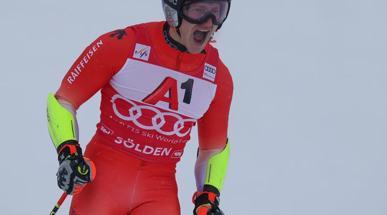 Switzerland's Marco Odermatt celebrates at the finish area of an alpine ski, men's World Cup giant slalom, in Soelden, Austria, Sunday, Oct. 26, 2025. (AP Photo/Alessandro Trovati)