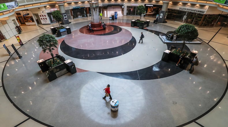 Hartsfield-Jackson International Airport was nearly empty in early April 2020. The year will be remembered for the enormous loss and disruption that the pandemic brought. (JOHN SPINK/JSPINK@AJC.COM)