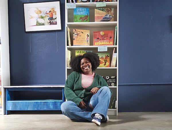 Children's book author and Impossible Moon Bookshop owner Breanna J. McDaniel in her downtown Hapeville shop. (Courtesy of Impossible Moon Bookshop)