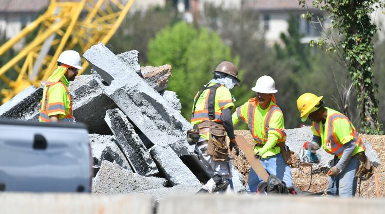 March 27, 2020 Sandy Springs - Construction takes place near the Mount Vernon Highway bridge along SR 400 in Sandy Springs on Friday, March 27, 2020. The Georgia Department of Transportation continues work on various road resurfacings, bridge projects and — in metro Atlanta — the reconstruction of the I-285/Ga. 400 interchange. (Hyosub Shin / Hyosub.Shin@ajc.com)