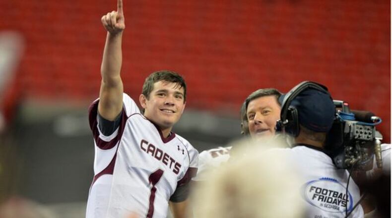 Benedictine quarterback Stevie Powers celebrates the GHSA Class AA Championship win in 2014. Brant Sanderlin/AJC BSANDERLIN@AJC.COM