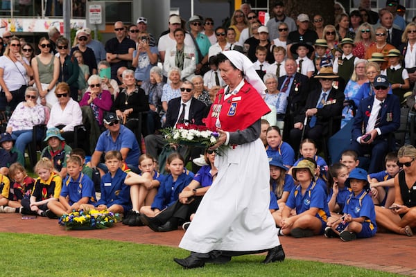 A veteran prepares to lay a wreath during the Anzac Day commemorations in Nelson Bay, Australia, Friday, April 25, 2025. (AP Photo/Mark Baker)