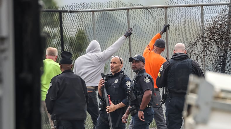 Atlanta police and construction personnel were on the construction site of the police training center Monday morning, March 6, 2023, in Atlanta examining equipment set on fire and destroyed by violent protests Sunday. Dozens of protesters dressed in all black threw large rocks, bricks, Molotov cocktails and fireworks at officers at the site on Sunday. (John Spink / John.Spink@ajc.com)