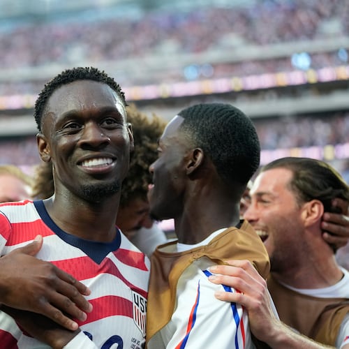 United States' Folarin Balogun, center, celebrates scoring his side's third goal against Paraguay with teamates during the World Cup Group D soccer match in Inglewood, Calif., near Los Angeles, Friday, June 12, 2026. (AP Photo/Andre Penner)