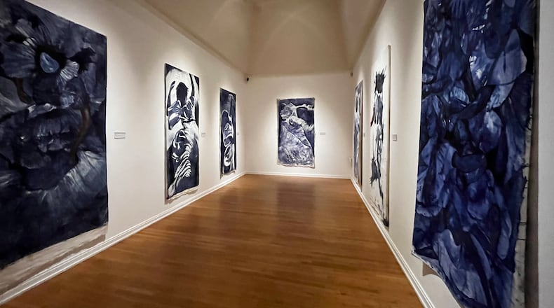 “Indigo Prayers” is located in a small, rectangular gallery where the seven paintings immerse the viewer in feelings of swirling movement and energy.