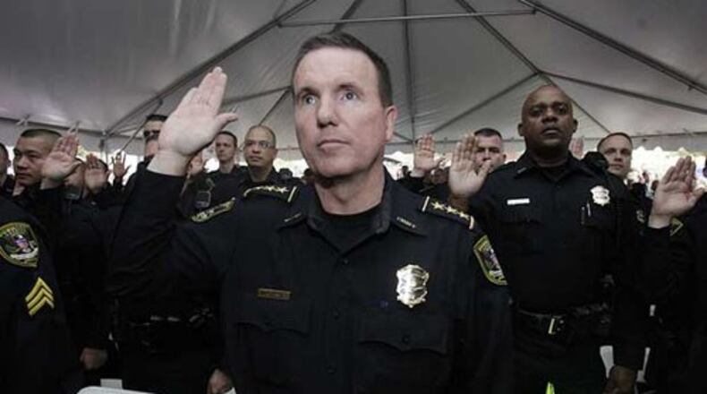Billy Grogan takes the oath of office in 2009 as the first police chief of the Dunwoody Police Department.