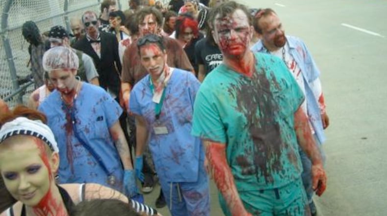 In the final act of Horrorfest III, participants dressed as zombies stroll down North Avenue – as this gory group did in 2007.