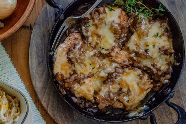 An overhead shot of Speedy French Onion Chicken in a cast iron pan.