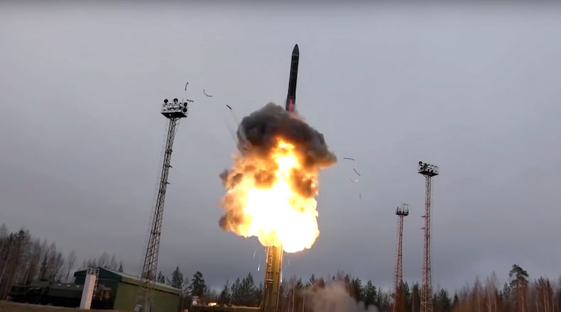 In this photo distributed by the Russian Defense Ministry Press Service, an intercontinental ballistic missile lifts off from a truck-mounted launcher in Russia. The Russian military said the Avangard hypersonic weapon entered combat duty Friday. The Kremlin has made modernization of Russia's strategic nuclear forces one of its top priorities.
