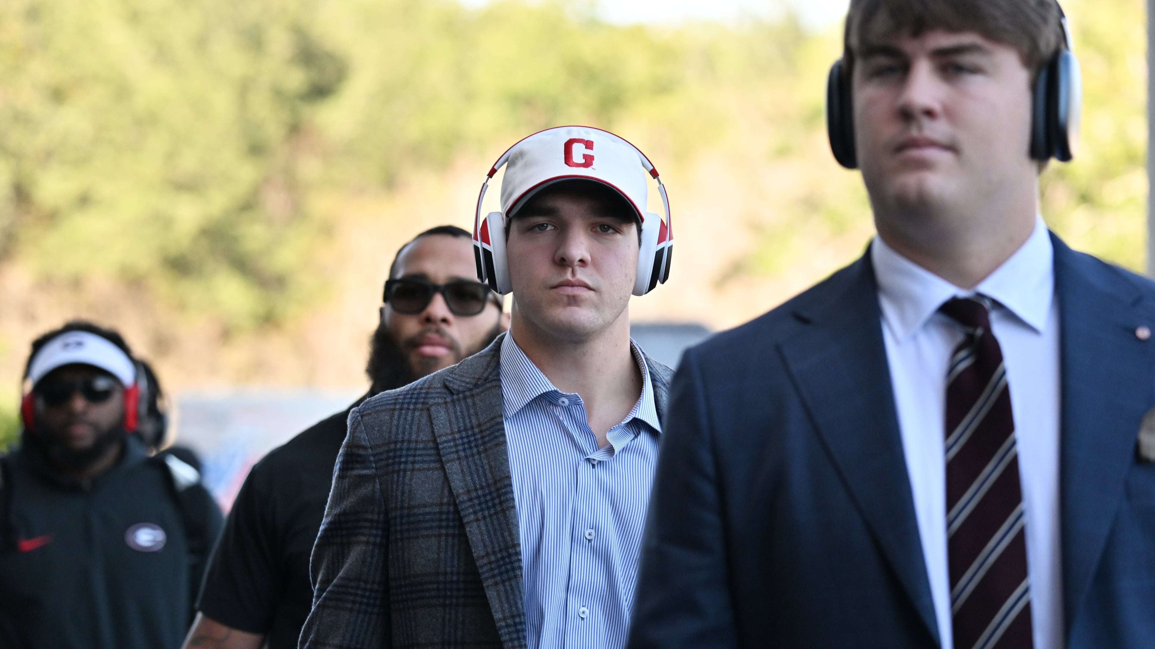 Bulldogs quarterback Gunner Stockton arrives with other players and coaching staff to EverBank Stadium on Saturday, Nov. 1, 2025, in Jacksonville, Fla. Georgia’s fourth-quarter drama — and heroics — has been critiqued, celebrated and everything in between. (Hyosub Shin/AJC)