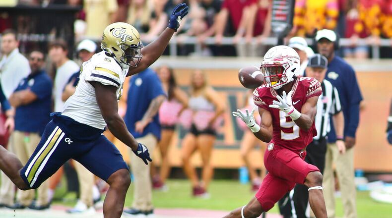Seminoles running back Lawrance Toafili catches a touchdown pass as Yellow Jackets defensive lineman Keion White pursues. Georgia Tech will try to snap a two-game losing streak this weekend. (AP Photo/Phil Sears)