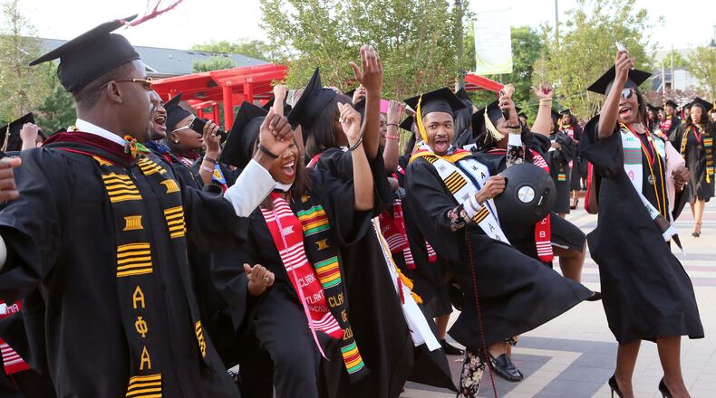 CLARK ATLANTA GRADS--May 16, 2016 - Atlanta - Graduates celebrate as they line up for the processional. Clark Atlanta University class of 2016 filled Panther Stadium Monday morning for it's 27th annual Commencement Service. The keynote speaker was retired astronaut Mae Jemison, the first woman of color in Space. Honorary degrees were awarded to Hamilton Bohannon, a 1964 graduate of Clark College; Roland Carter; Congressman John Conyers, and Congressman Hank Johnson, a 1976 Clark College graduate. BOB ANDRES / BANDRES@AJC.COM