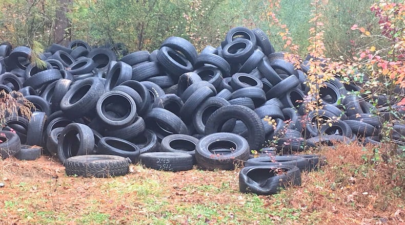 County crews begin cleanup of illegally dumped tires at Fork Creek Mountain Park. CONTRIBUTED