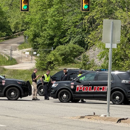 Police block a road near a chemical plant where a leak occurred Wednesday, April 22, 2026, in Institute, W.Va. (AP Photo/John Raby)