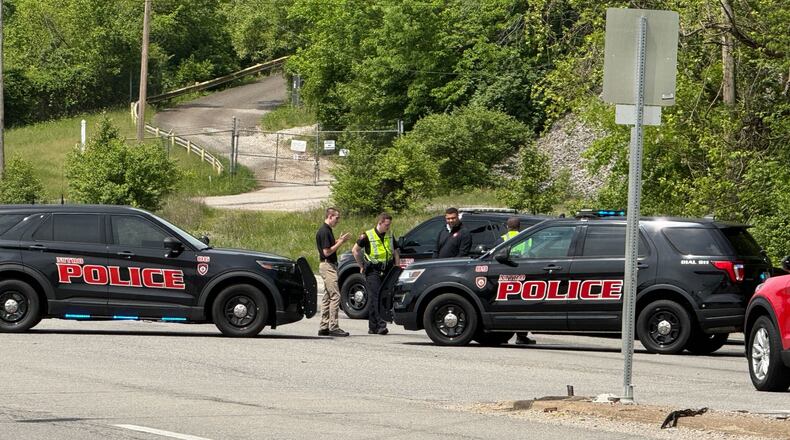 Police block a road near a chemical plant where a leak occurred Wednesday, April 22, 2026, in Institute, W.Va. (AP Photo/John Raby)