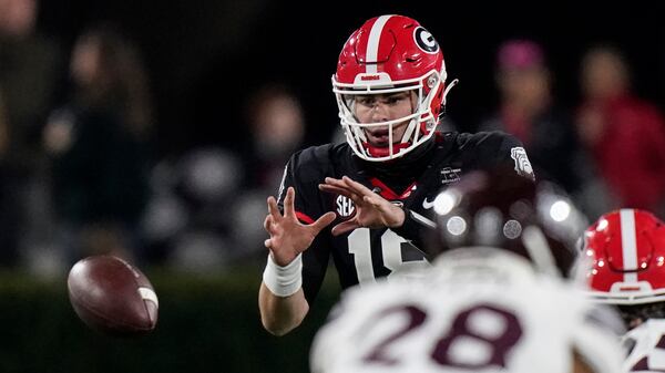 Georgia quarterback JT Daniels (18) takes a snap Saturday, Nov. 21, 2020, in Athens. (Brynn Anderson/AP)