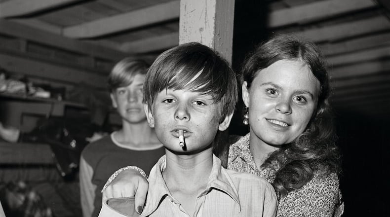 “Untitled, R2-11” by photographer Bill Yates featuring the denizens of a Florida roller skating rink in the 1970s.