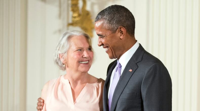 FILE - President Barack Obama appears with author Annie Dillard, recipient of the 2014 National Humanities Medal, during a ceremony in the East Room at the White House in Washington on Sept. 10, 2015. (AP Photo/Andrew Harnik, File)