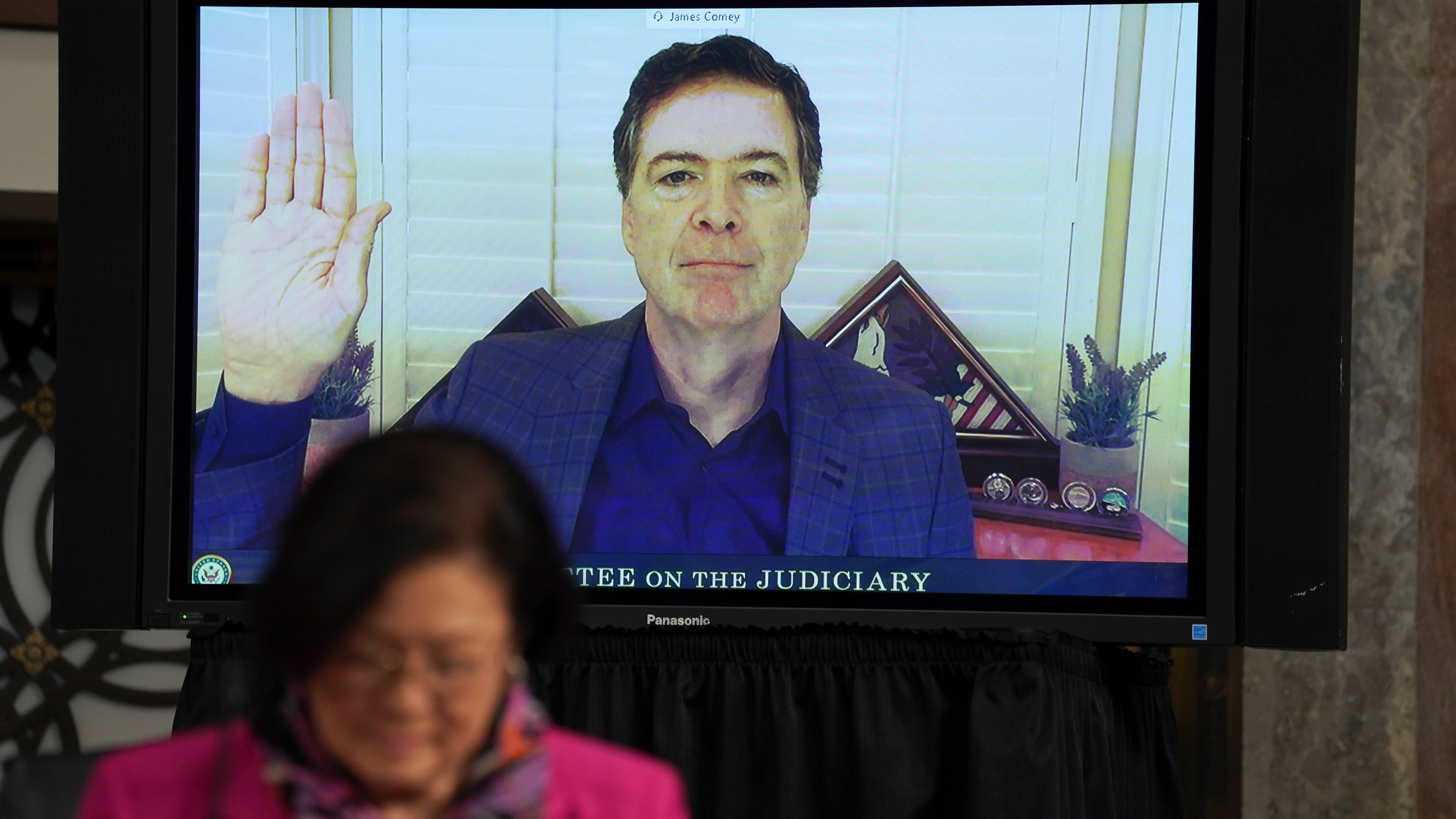 FILE - Former FBI director James Comey is sworn in before testifying via videoconference during a Senate Judiciary Committee hearing on Capitol Hill in Washington, Sept. 30, 2020. (Stefani Reynolds/Pool via AP, File)