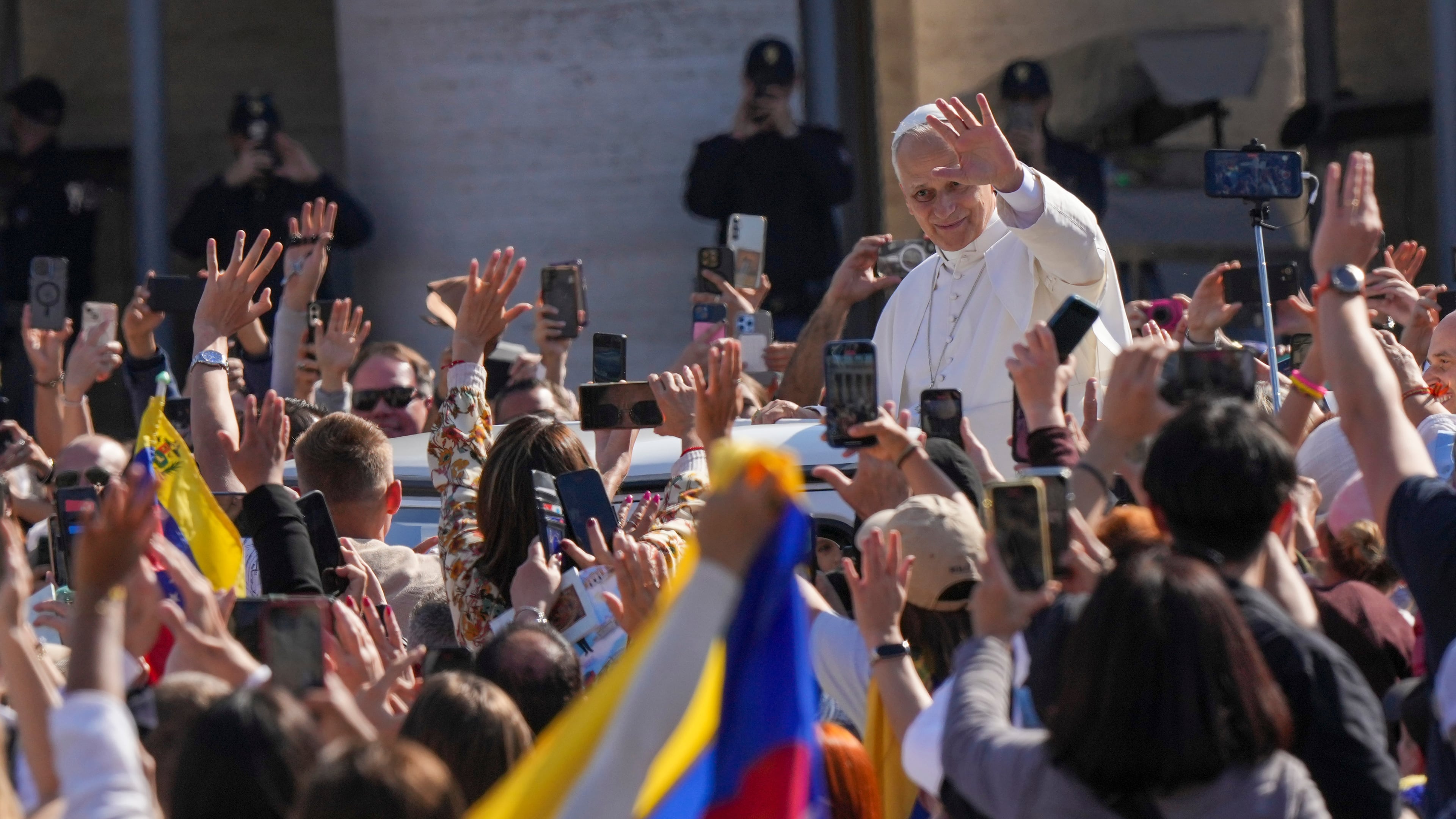Pope Leo XIV tours on his popemobile after presiding over a Mass in St. Peter's Square at the Vatican during which he canonized seven new saints of the Catholic Church, Sunday, Oct. 19, 2025. (AP Photo/Andrew Medichini)