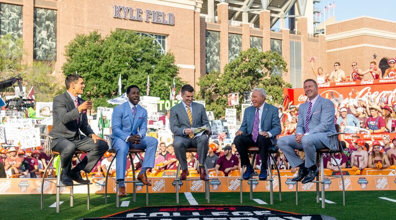 FILE - In this Sept. 8, 2018, file photo ,ESPN College Game Day's crew sits on set in front of Kyle Field in College Station, Texas. before the start of an NCAA college football game between Clemson and Texas A&M. After 15 years of the Washington State flag begin a backdrop fixture to every “College GameDay” broadcast, ESPN is going to Pullman Wash., on Saturday.(AP Photo/Sam Craft, File)