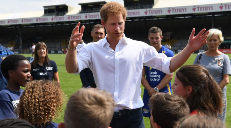 Britain's Prince Harry meets schoolchildren during his visit to the Headingley Carnegie Stadium on Thursday.
