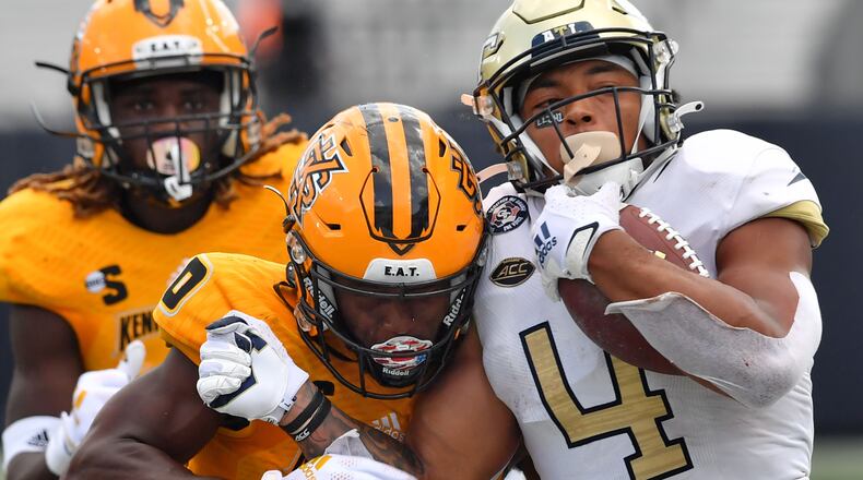 September 11, 2021 Atlanta - Georgia Tech's running back Dontae Smith (4) gets tackled by Kennesaw State's defensive back Java'n Singletary (0) during the second half of an NCAA college football game at Georgia Tech's Bobby Dodd Stadium in Atlanta on Saturday, September 11, 2021. Georgia Tech won 45-17 over Kennesaw State. (Hyosub Shin / Hyosub.Shin@ajc.com)