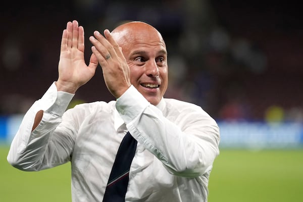 Italy head coach Andrea Soncin applauds the fans at the end of the Women's Euro 2025 quarterfinals soccer match between Norway and Italy at Stade de Geneve in Geneva, Switzerland, Wednesday, July 16, 2025. (AP Photo/Alessandra Tarantino)