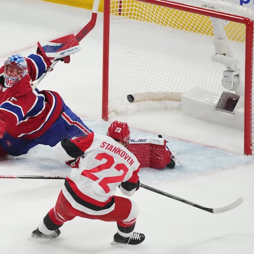 Carolina Hurricanes' Logan Stankoven (22) scores on Montreal Canadiens goaltender Jakub Dobes (75) during the first period of Game 4 of NHL Eastern Conference final Stanley Cup playoff series action in Montreal, Quebec, Wednesday, May 27, 2026. (Christinne Muschi/The Canadian Press via AP)