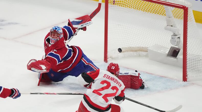 Carolina Hurricanes' Logan Stankoven (22) scores on Montreal Canadiens goaltender Jakub Dobes (75) during the first period of Game 4 of NHL Eastern Conference final Stanley Cup playoff series action in Montreal, Quebec, Wednesday, May 27, 2026. (Christinne Muschi/The Canadian Press via AP)
