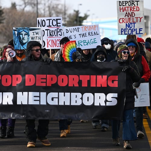 Protesters gather at a rally for immigrant and worker outside Signature Aviation near the Minneapolis–Saint Paul International Airport, Wednesday, Dec 3, 2025, in Minneapolis. (AP Photo/Tom Baker)