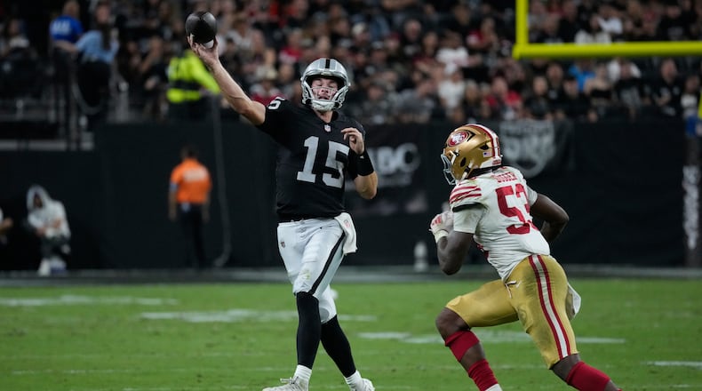 Las Vegas Raiders quarterback Fernando Mendoza (15) throws under pressure from San Francisco 49ers linebacker Jaden Dugger (53) during the second half of an NFL preseason football game, Thursday, Aug. 27, 2026, in Las Vegas. (AP Photo/John Locher)