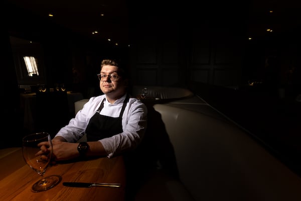 Incoming executive chef Joseph Harrison poses at Aria in Atlanta on Thursday.  (Arvin Temkar/AJC)